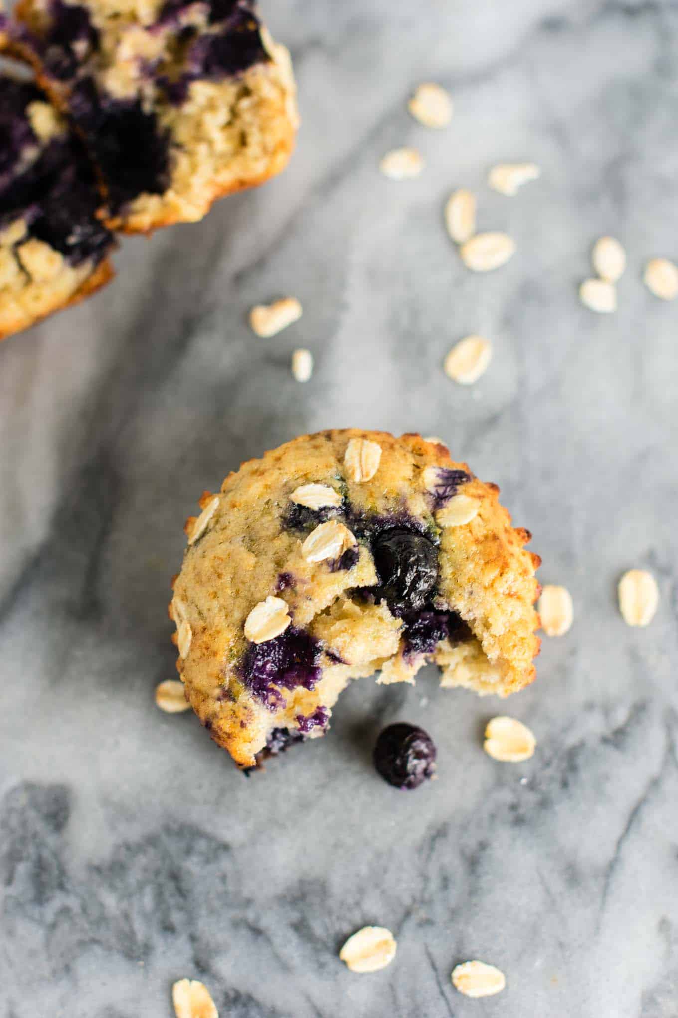 Healthy Blueberry Muffins with greek yogurt and coconut oil. Melt in your mouth crazy delicious! A protein packed healthy breakfast on the go. #healthyblueberrymuffins #blueberrymuffins #breakfast #greekyogurt #healthybreakfast