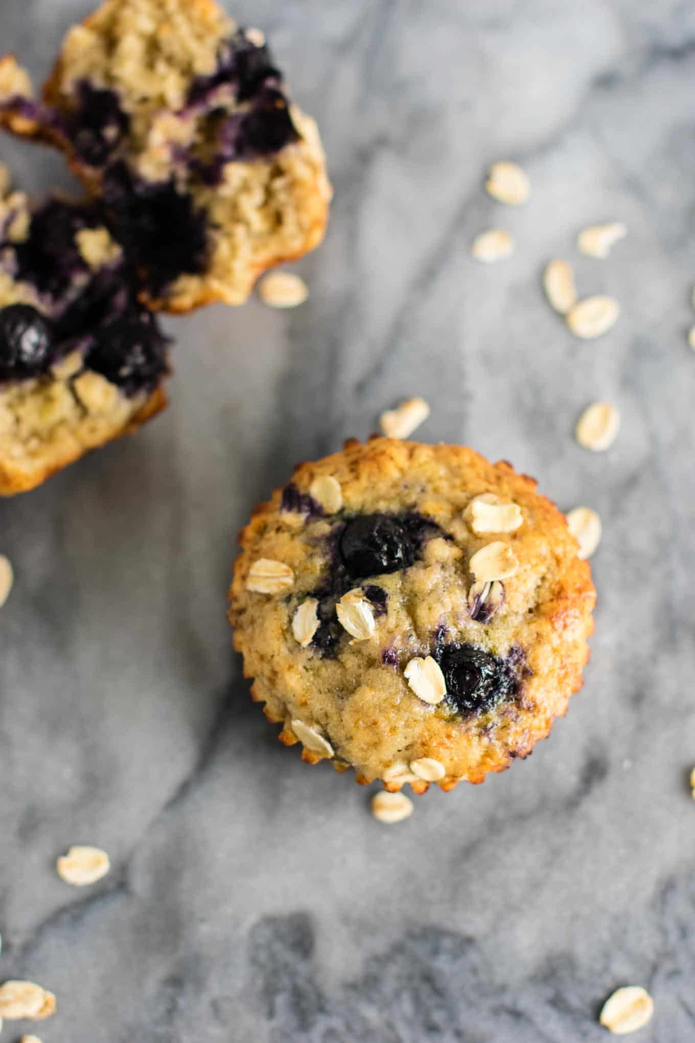 Healthy Blueberry Muffins with greek yogurt and coconut oil. Melt in your mouth crazy delicious! A protein packed healthy breakfast on the go. #healthyblueberrymuffins #blueberrymuffins #breakfast #greekyogurt #healthybreakfast