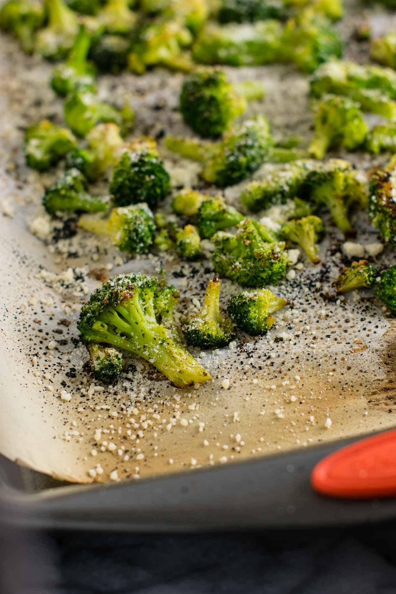 frozen broccoli finished on a parchment paper lined baking sheet