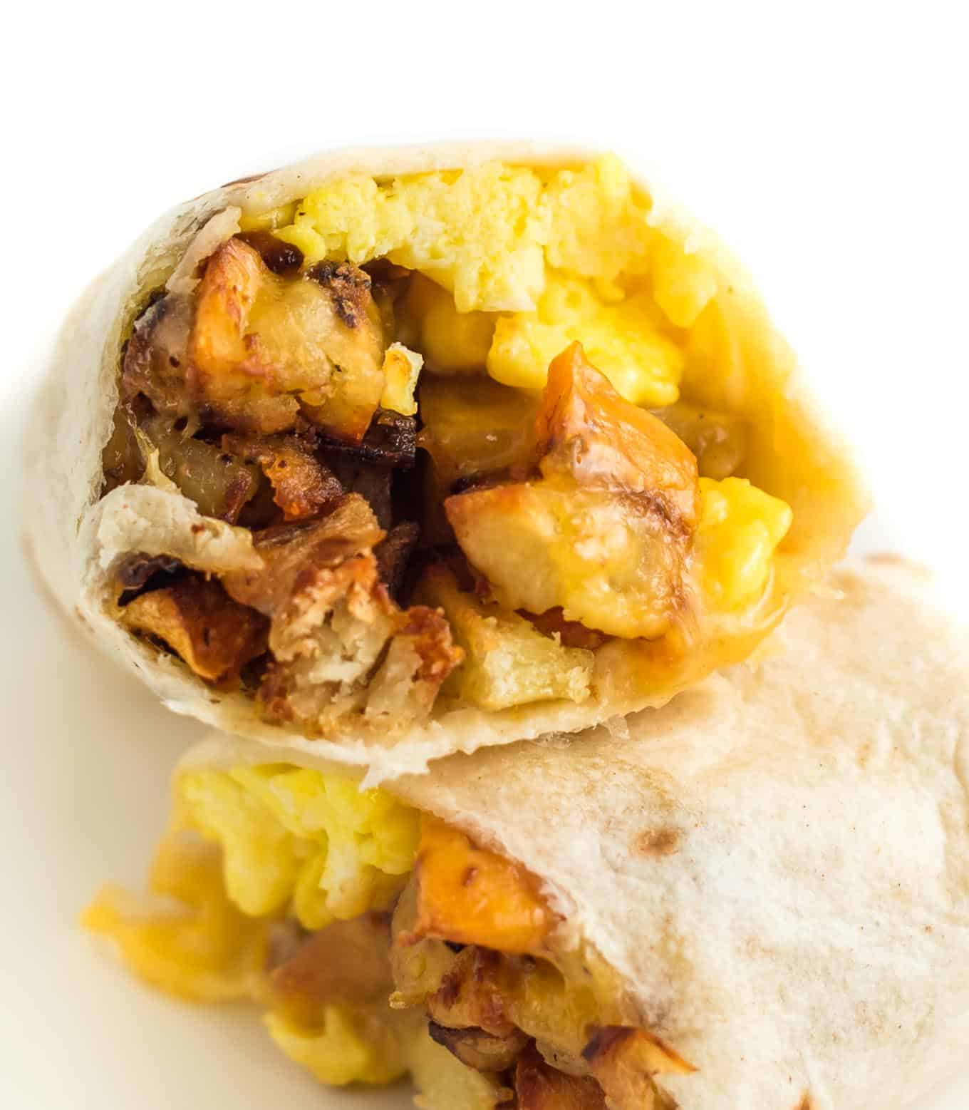 breakfast burrito stuffed with scrambled eggs and hash