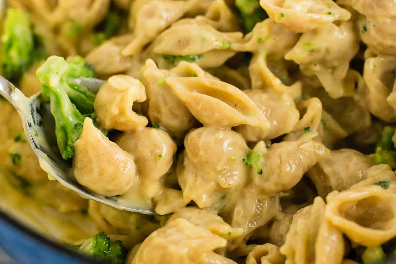 Lightened up broccoli shells and cheese with sharp cheddar cheese and whole wheat pasta. The healthiest way to justify eating macaroni and cheese for dinner. Kids will love this one! #broccolishellsandcheese #macandcheese #healthy #dinner #vegetarian #meatless #pasta #wholewheat