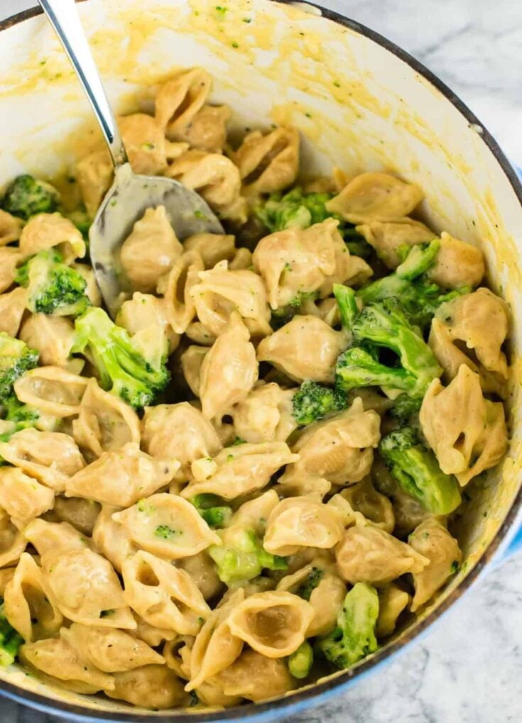 Lightened up broccoli shells and cheese with sharp cheddar cheese and whole wheat pasta. The healthiest way to justify eating macaroni and cheese for dinner. Kids will love this one! #broccolishellsandcheese #macandcheese #healthy #dinner #vegetarian #meatless #pasta #wholewheat