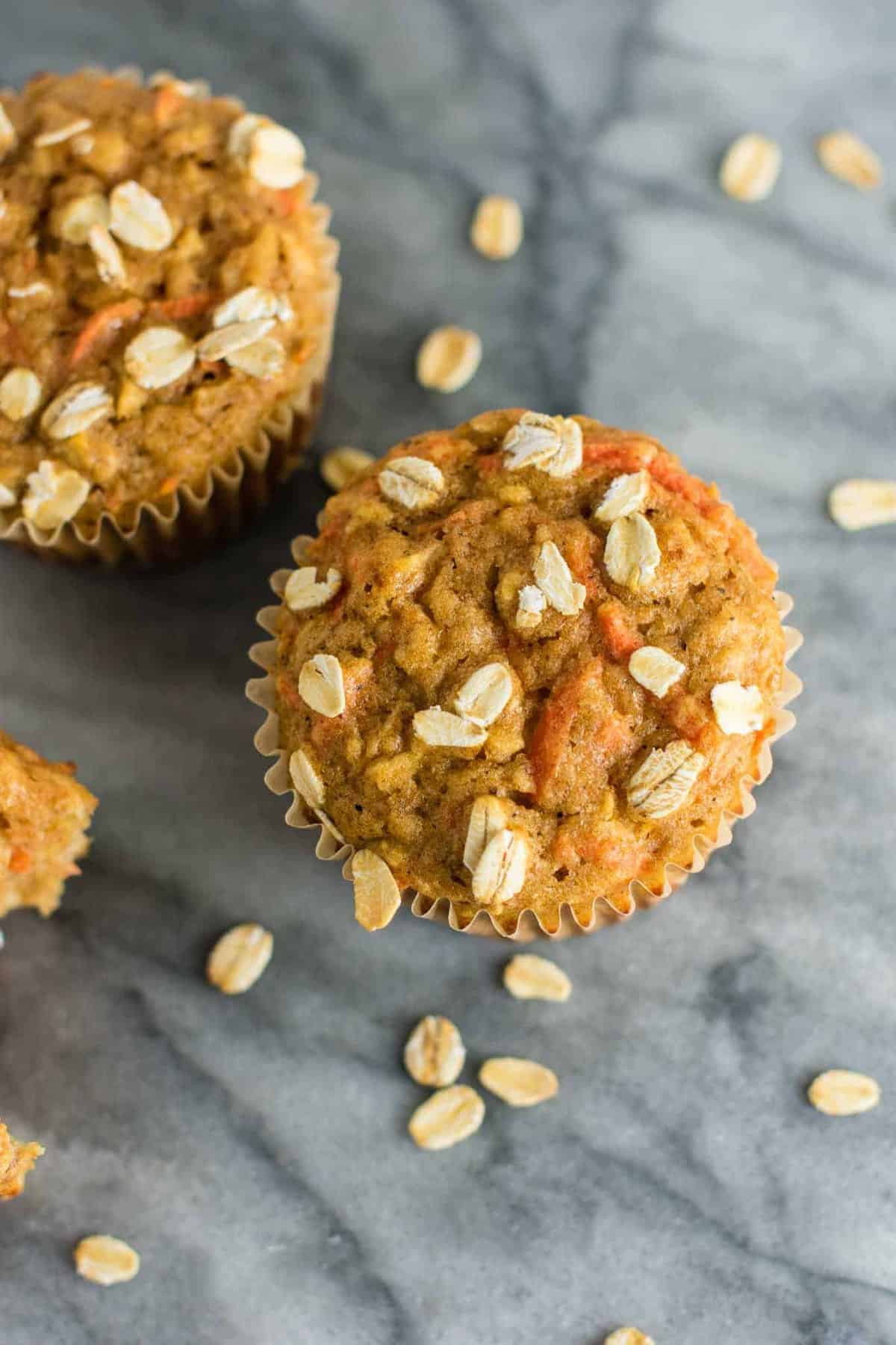 Wholesome Carrot Apple Muffins made with pure maple syrup and greek yogurt. Kids will love these! A feel good breakfast or snack for the whole family. (oil free, naturally sweetened) #carrotapplemuffins #healthymuffins #healthysnack #kidfriendlysnack #greekyogurt #vegetarian