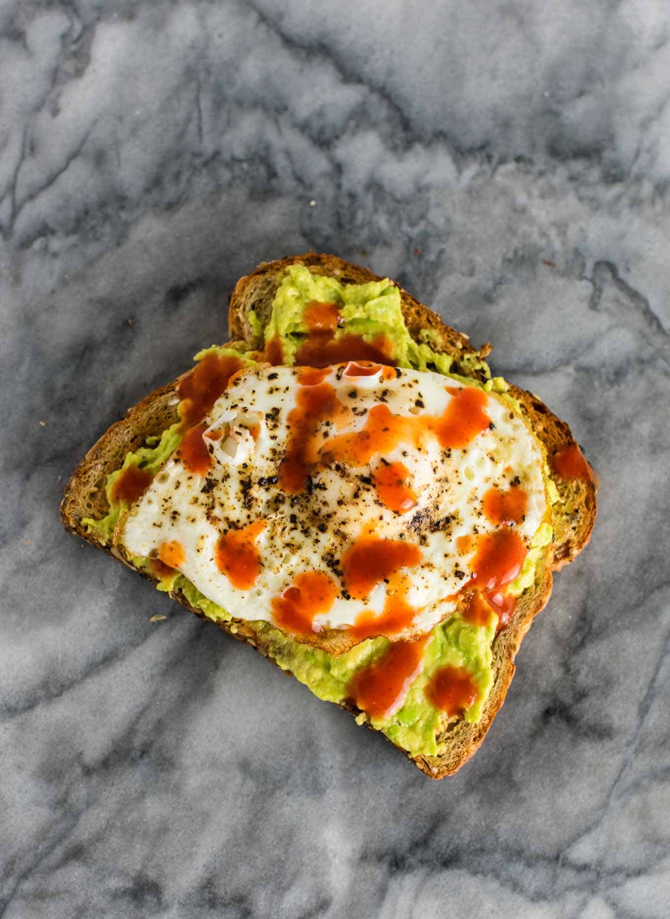 Spicy Avocado Egg Toast - really easy but so delicious. I make this all the time! #breakfast #avocadotoast #eggs #vegetarian #meatless