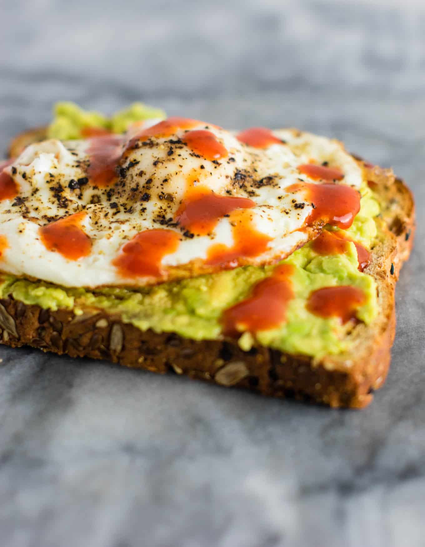Spicy Avocado Egg Toast - really easy but so delicious. I make this all the time! #breakfast #avocadotoast #eggs #vegetarian #meatless
