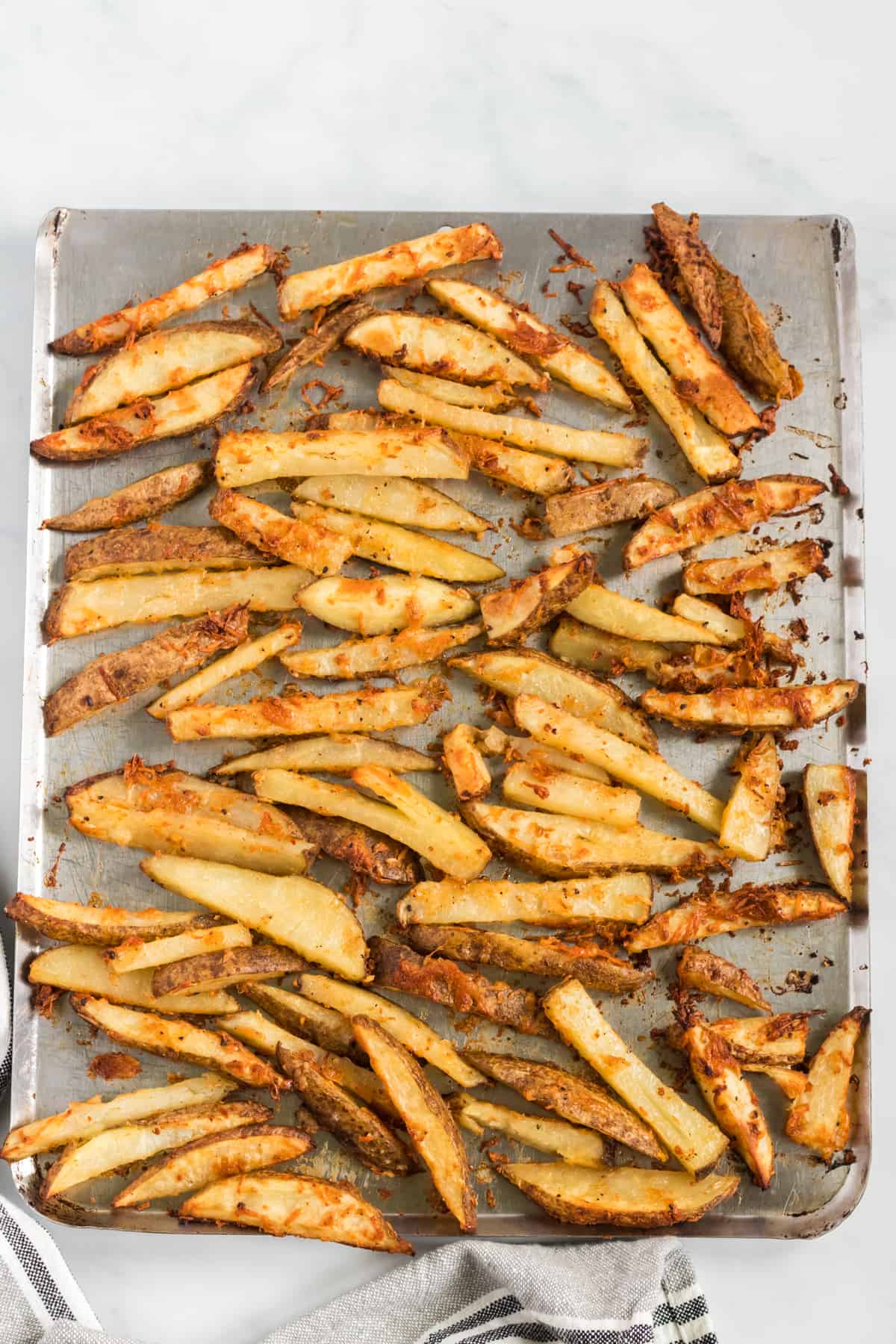 potato wedges on a baking sheet