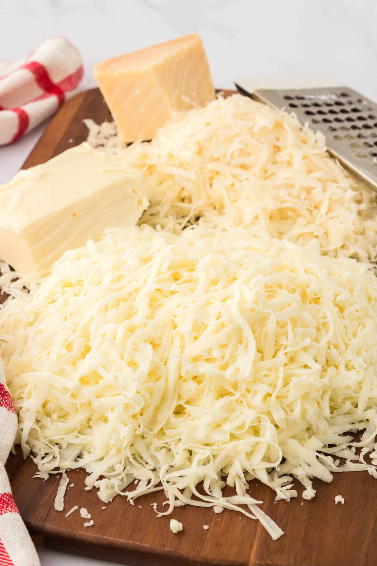 grated cheese on a cutting board
