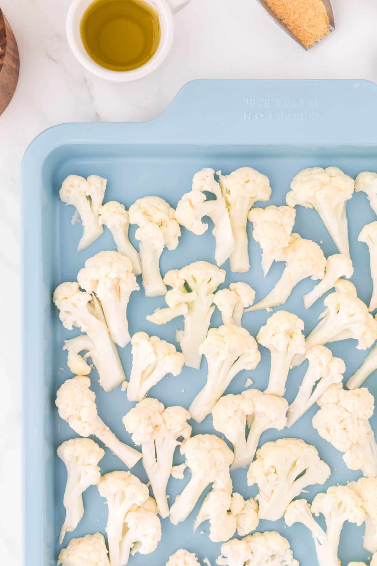 cauliflower florets on a baking sheet