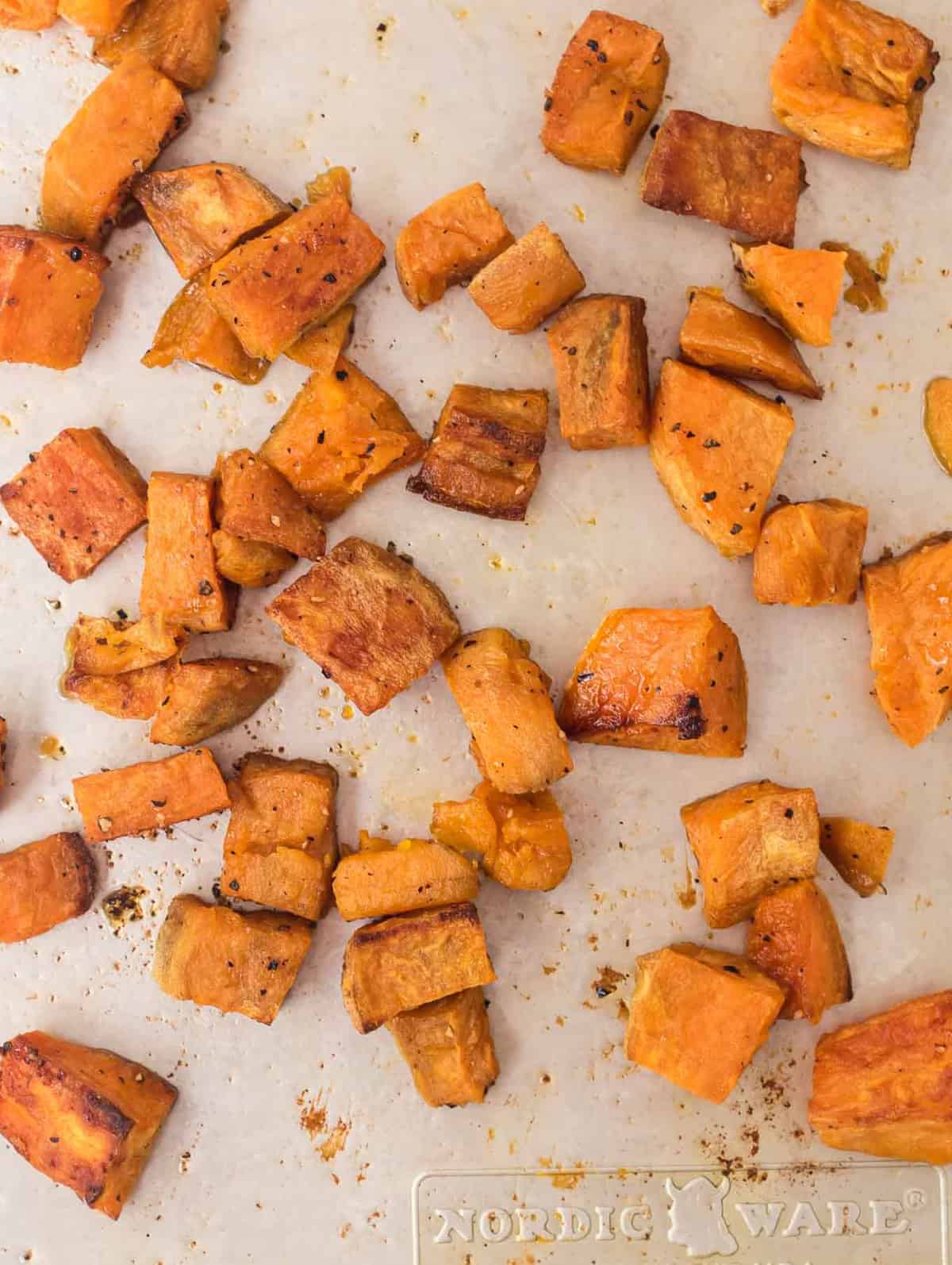 roasted sweet potatoes cubed on a baking sheet