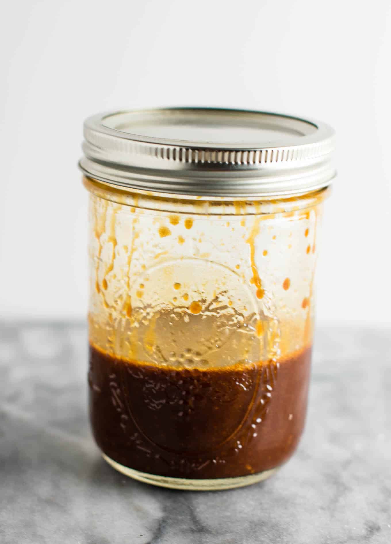 mason jar with shaken up stir fry sauce in it