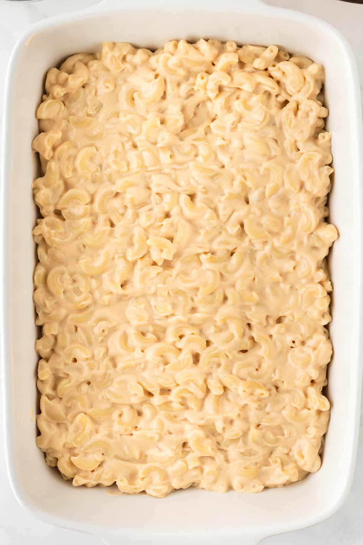 mac and cheese spread out in a baking dish