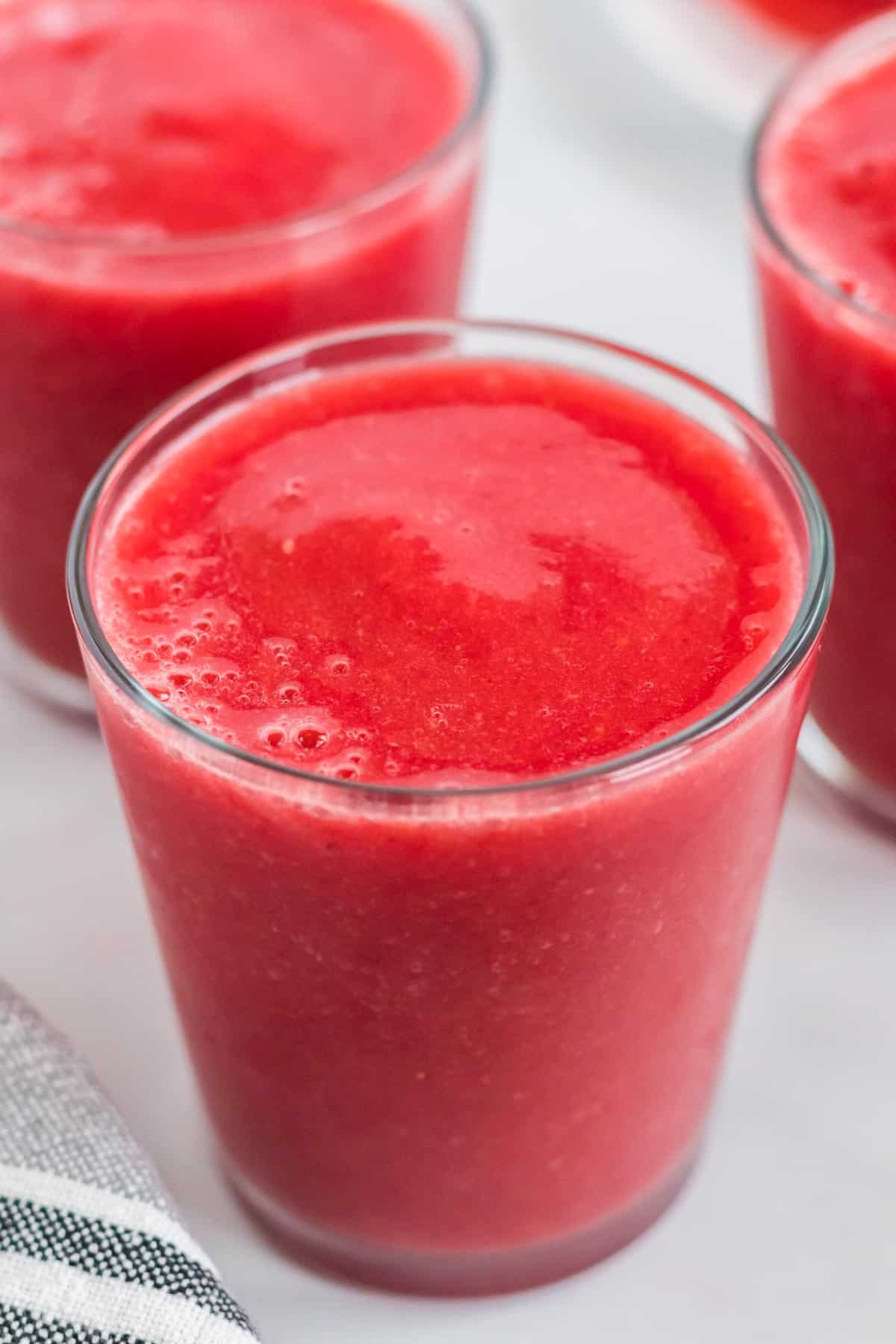 strawberry watermelon smoothie in a clear glass