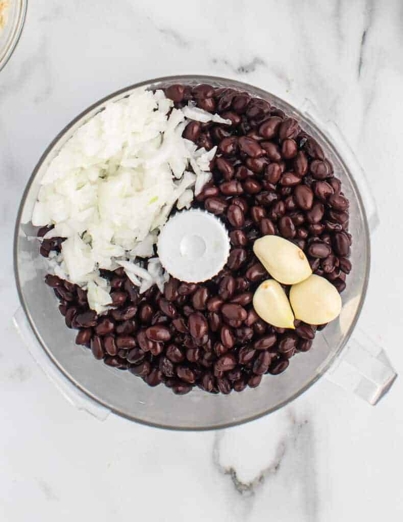 black beans, garlic, and onion in a food processor