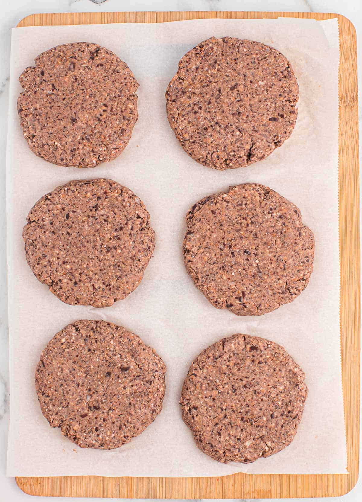 black bean burgers on parchment paper