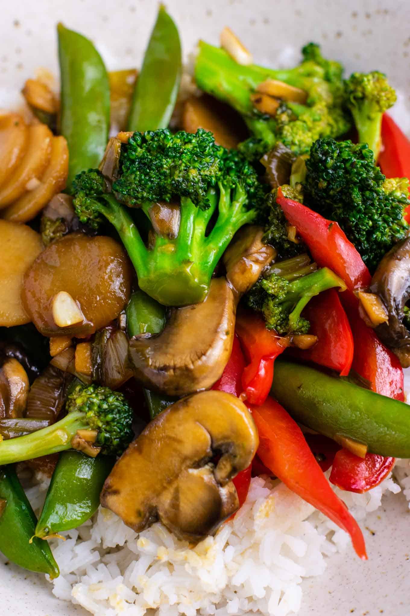 Veggie stir fry  with broccoli, bell pepper, mushroom, snap peas, onion, garlic, and ginger