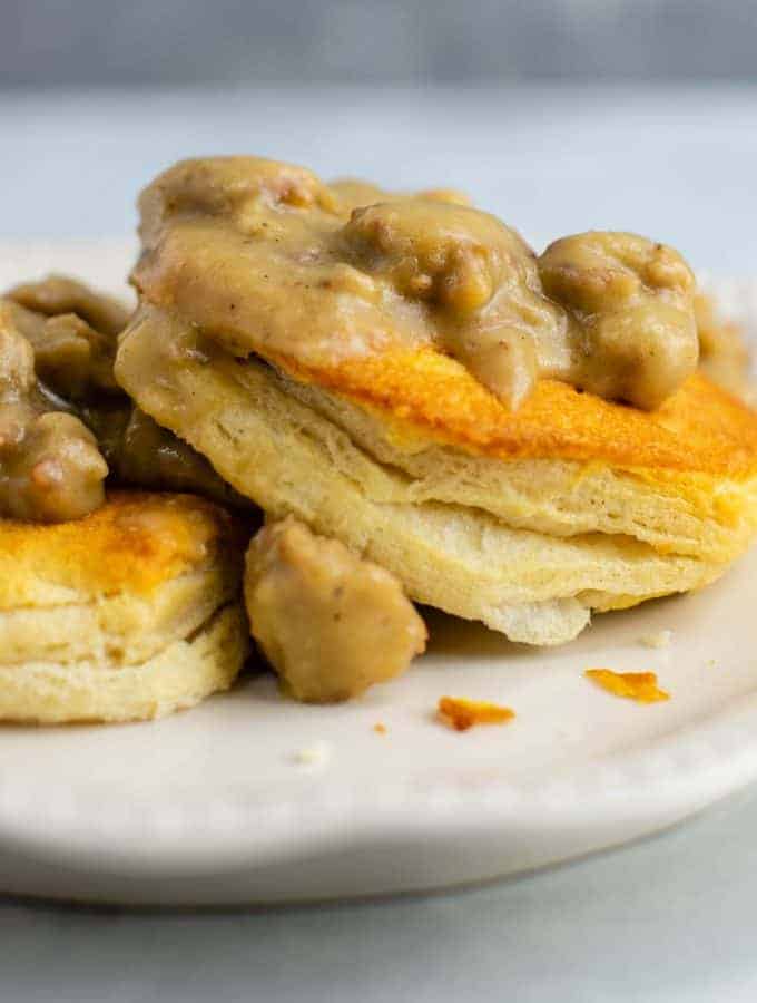 Vegetarian biscuits and gravy with vegan sausage. This is crazy good! #vegetarian #biscuitsandgravy #meatless #breakfast #gravy #vegetariangravy #comfortfood #breakfastrecipe