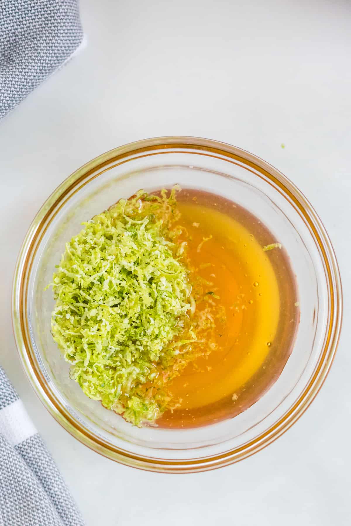 honey and lime zest in a bowl