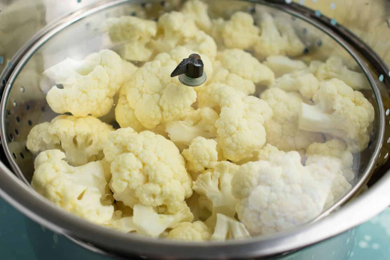How to steam cauliflower with a pot, strainer, and lid