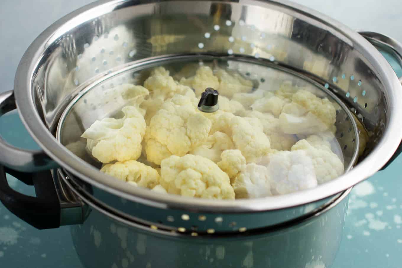 How to steam cauliflower with a pot, strainer, and lid