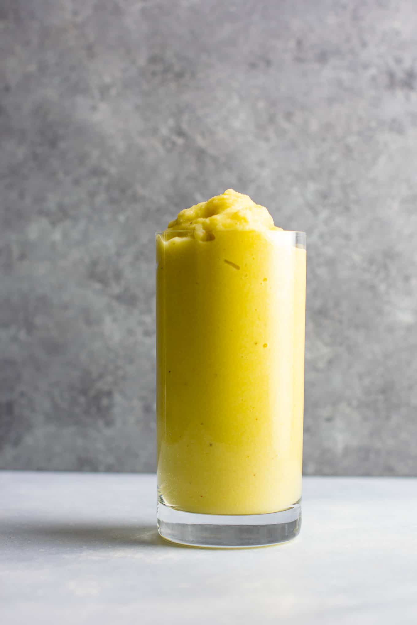 Pineapple detox smoothie with cucumbers, celery, lemon, peaches, ginger, and frozen bananas. A healthy smoothie recipe that tastes delicious! #detox #detoxsmoothie #healthysmoothie #vegan #healthyeating #healthyrecipe #smoothie #vegansmoothie