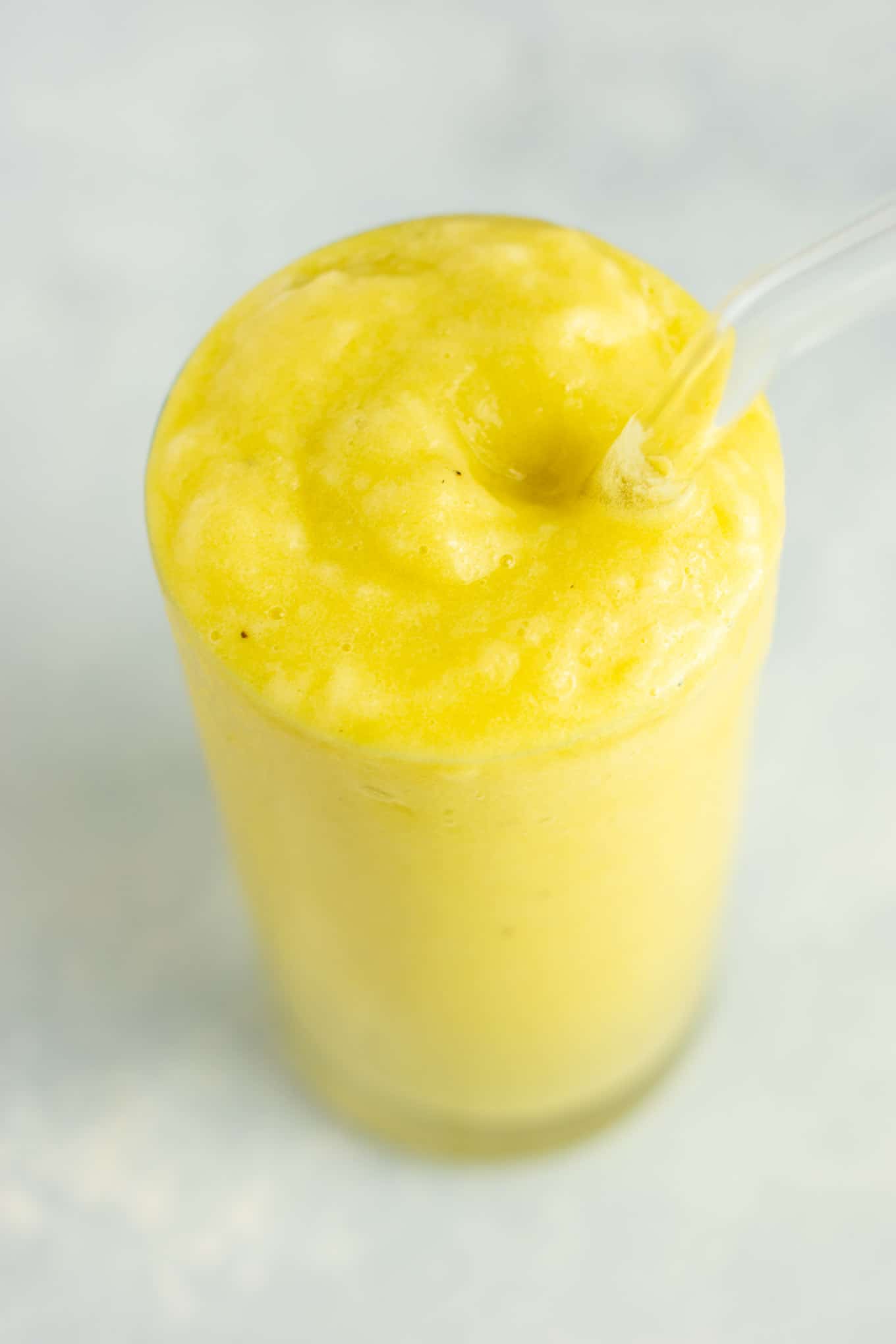 Pineapple detox smoothie with cucumbers, celery, lemon, peaches, ginger, and frozen bananas. A healthy smoothie recipe that tastes delicious! #detox #detoxsmoothie #healthysmoothie #vegan #healthyeating #healthyrecipe #smoothie #vegansmoothie