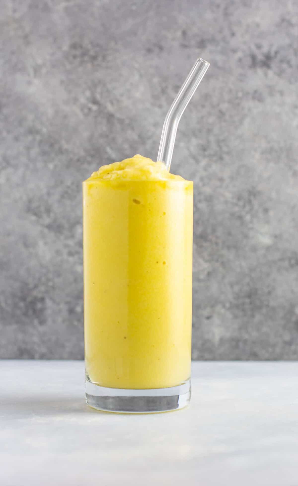 Pineapple detox smoothie with cucumbers, celery, lemon, peaches, ginger, and frozen bananas. A healthy smoothie recipe that tastes delicious! #detox #detoxsmoothie #healthysmoothie #vegan #healthyeating #healthyrecipe #smoothie #vegansmoothie 