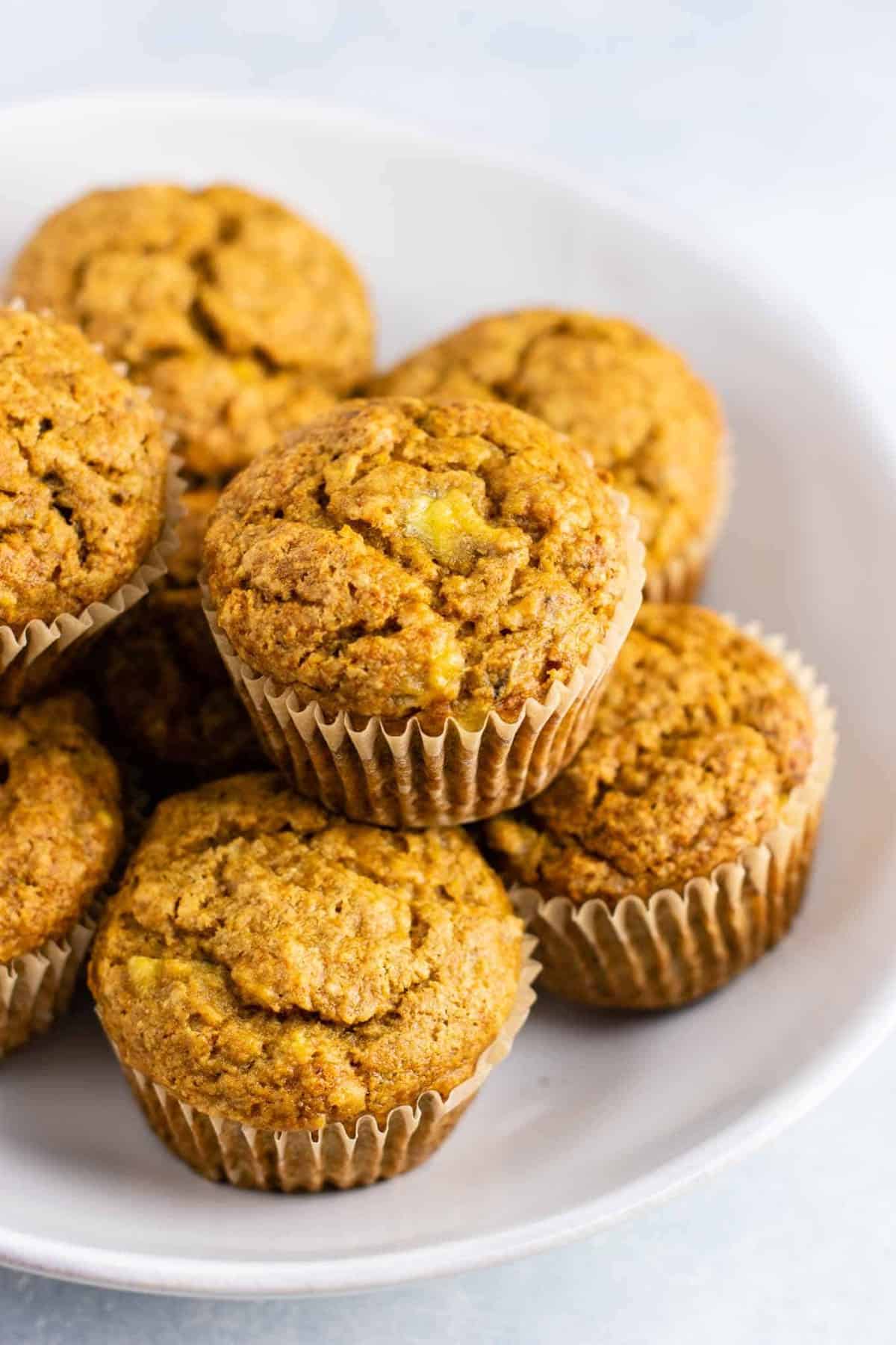 Healthy and easy vegan banana muffins recipe with applesauce – these are amazing and totally oil free! No flax eggs or difficult ingredients. So easy and a great vegan breakfast or snack. #veganbananamuffins #veganbreakfast #vegan #breakfast #healthymuffins #healthybananamuffins #veganmuffins