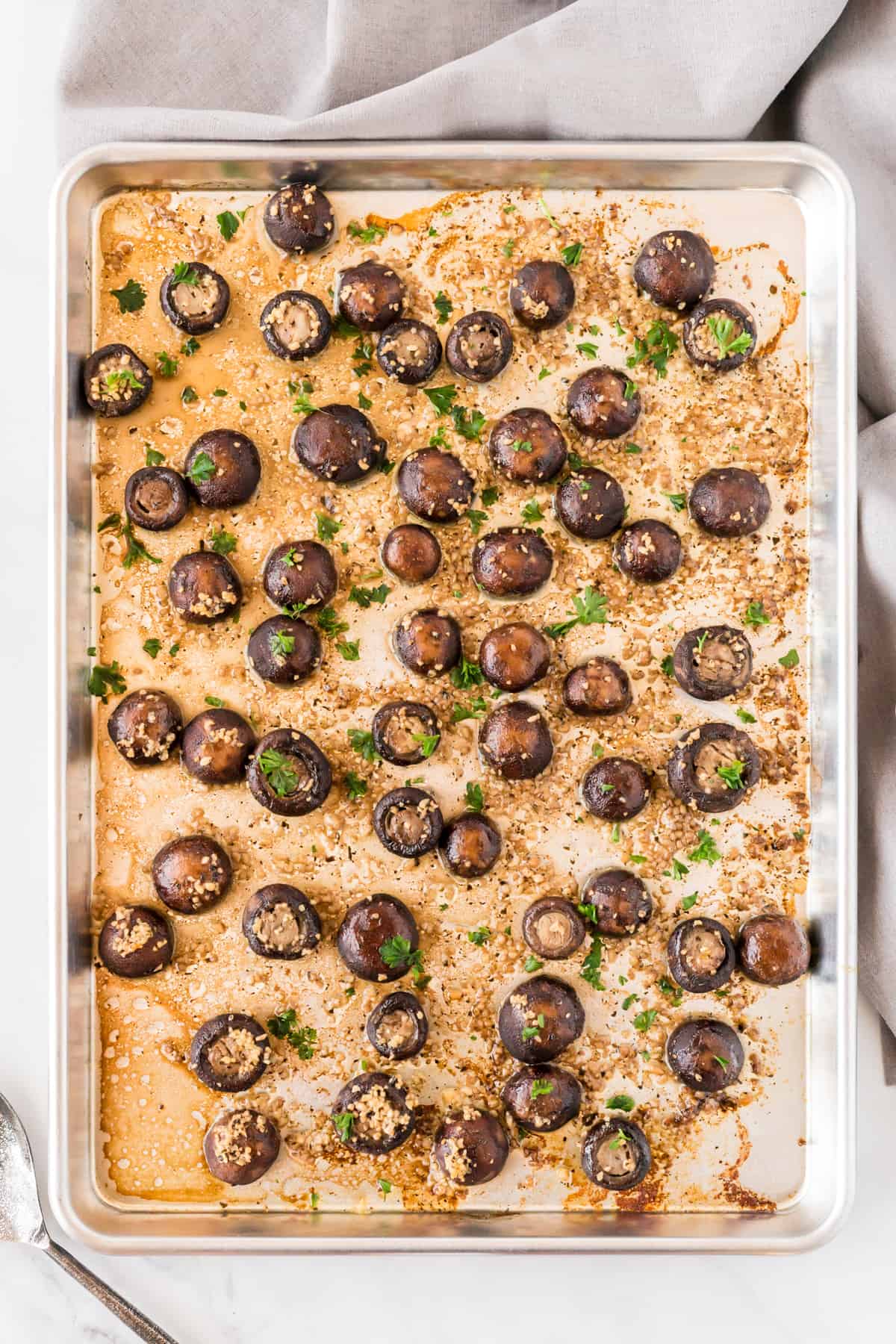 roasted garlic mushrooms on a sheet pan from an overhead view