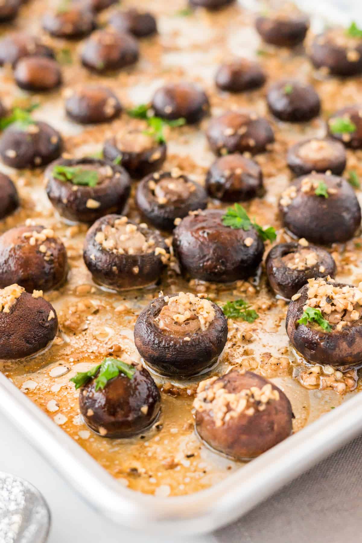 mushrooms roasted in garlic butter on a baking sheet