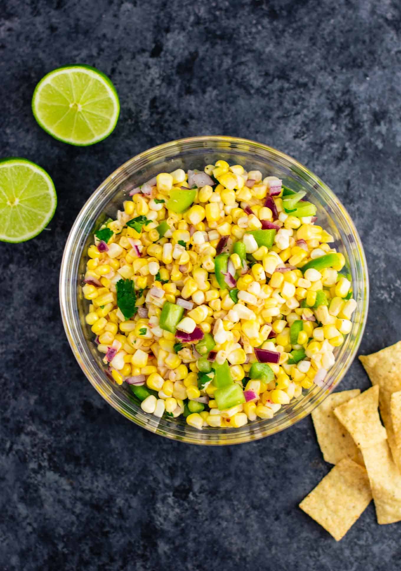 vegetarian mexican recipes:The best easy fresh corn salsa recipe made with just a few ingredients. It tastes better than chipotle and is ready in minutes! Make your own burrito bowls at home with this awesome corn salsa. #chipotlecornsalsa #cornsalsa #chipotle #burritobowl #appetizer #vegan #corn #appetizer