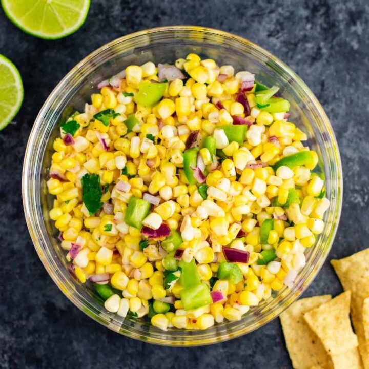 The best easy fresh corn salsa recipe made with just a few ingredients. It tastes better than chipotle and is ready in minutes! Make your own burrito bowls at home with this awesome corn salsa. #chipotlecornsalsa #cornsalsa #chipotle #burritobowl #appetizer #vegan #corn #appetizer