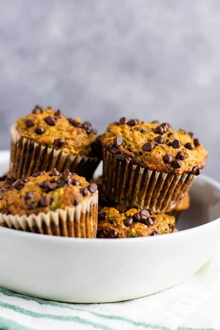Healthy zucchini chocolate chip muffins made with easy ingredients. Perfect for using up all of that summer zucchini! #zucchini #muffins #chocolatechip #healthy #breakfast #vegetarian