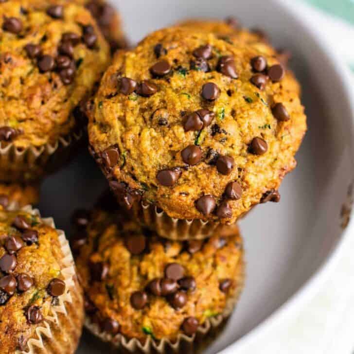 Healthy chocolate chip zucchini muffins made with easy ingredients. Perfect for using up all of that summer zucchini! #zucchini #muffins #chocolatechip #healthy #breakfast #vegetarian