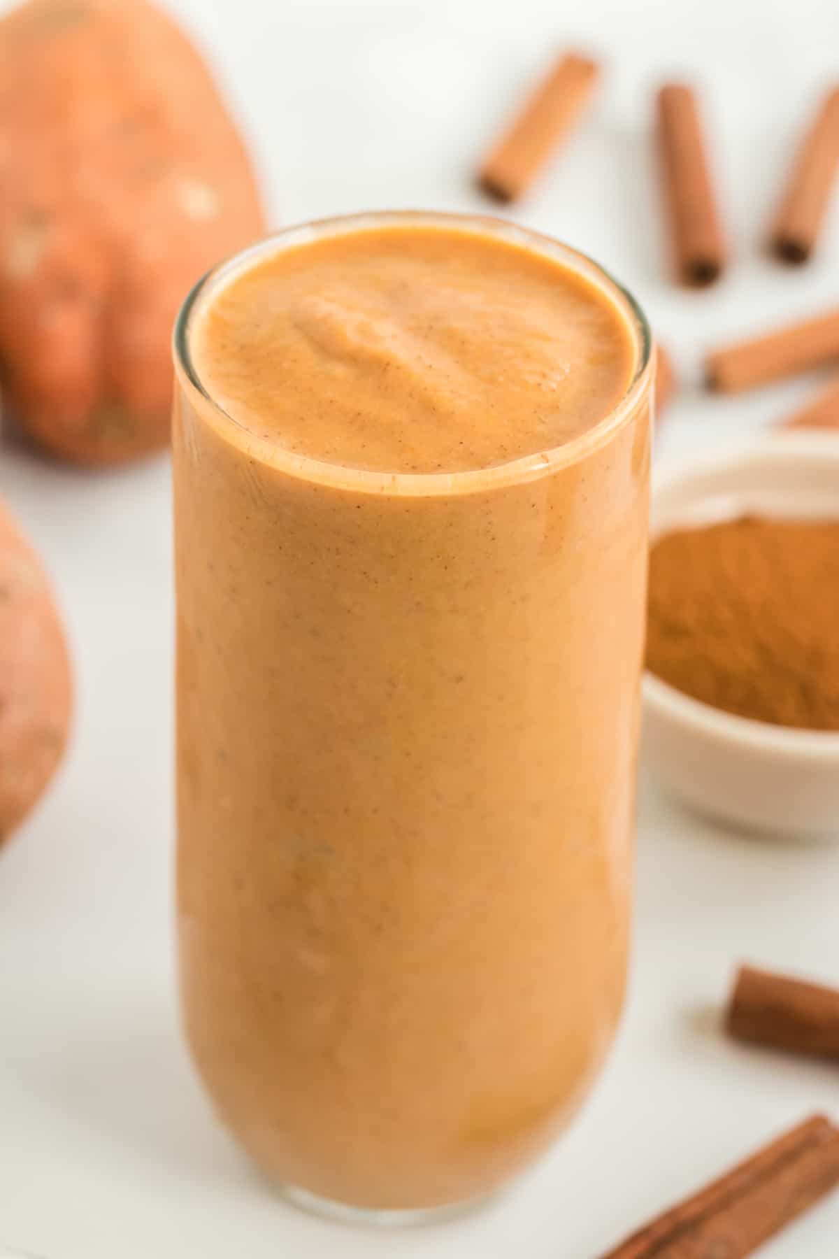 tall glass filled with sweet potato smoothie