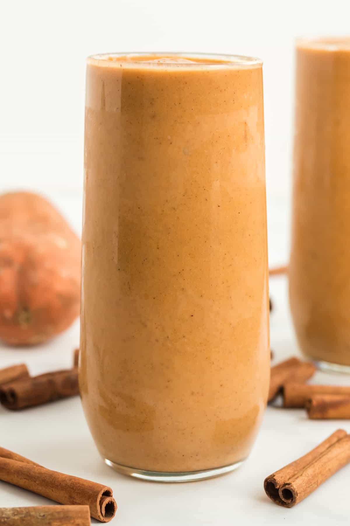 tall glass filled with sweet potato smoothie