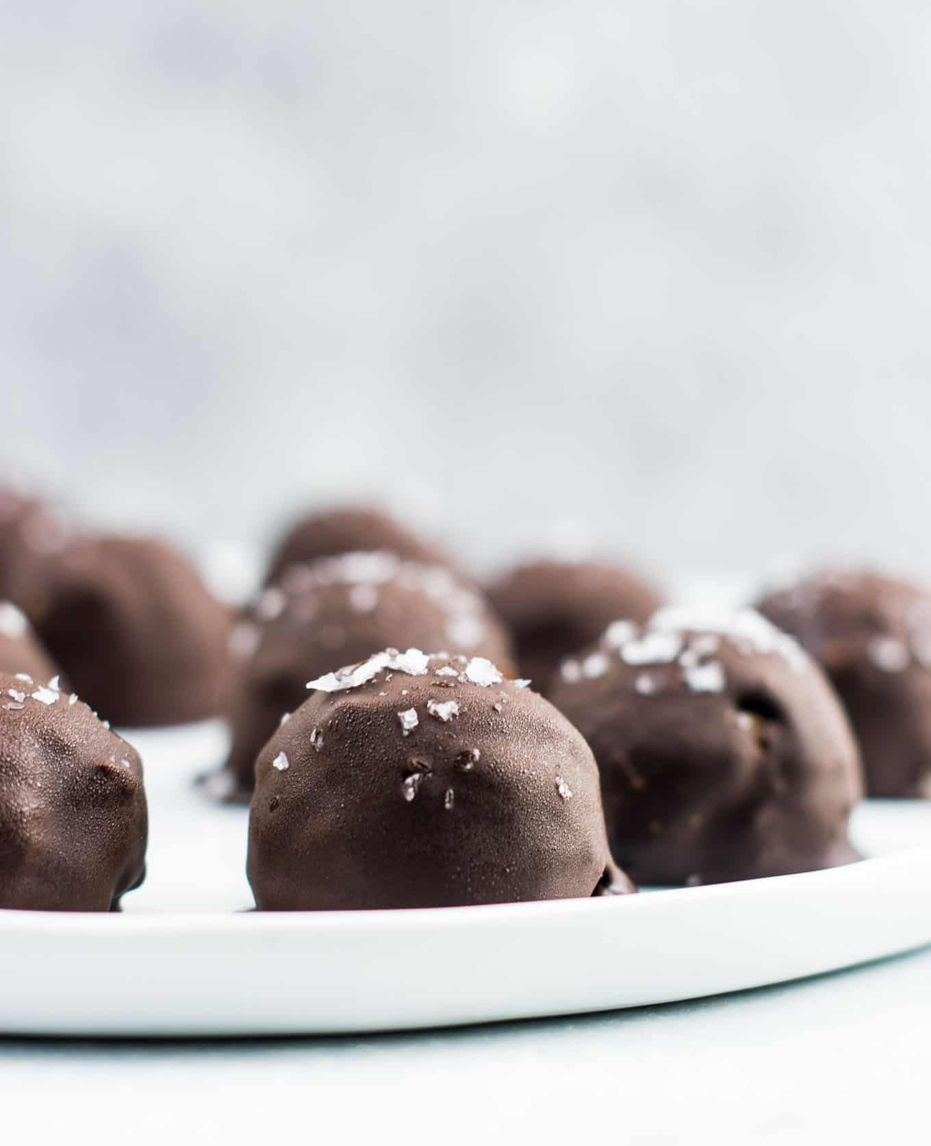 Dark chocolate pumpkin truffles on a plate