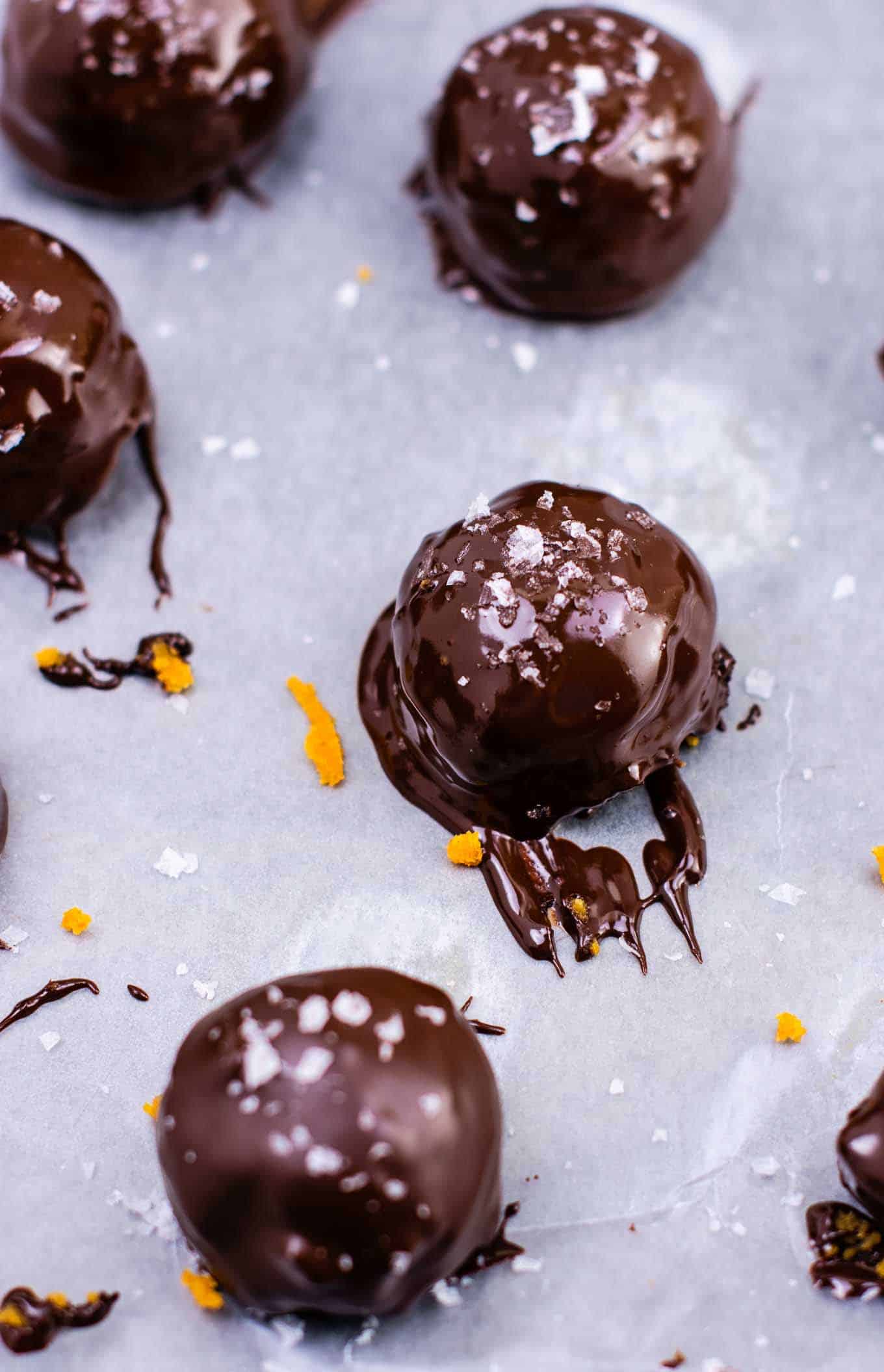 pumpkin truffles freshly dipped in melted chocolate