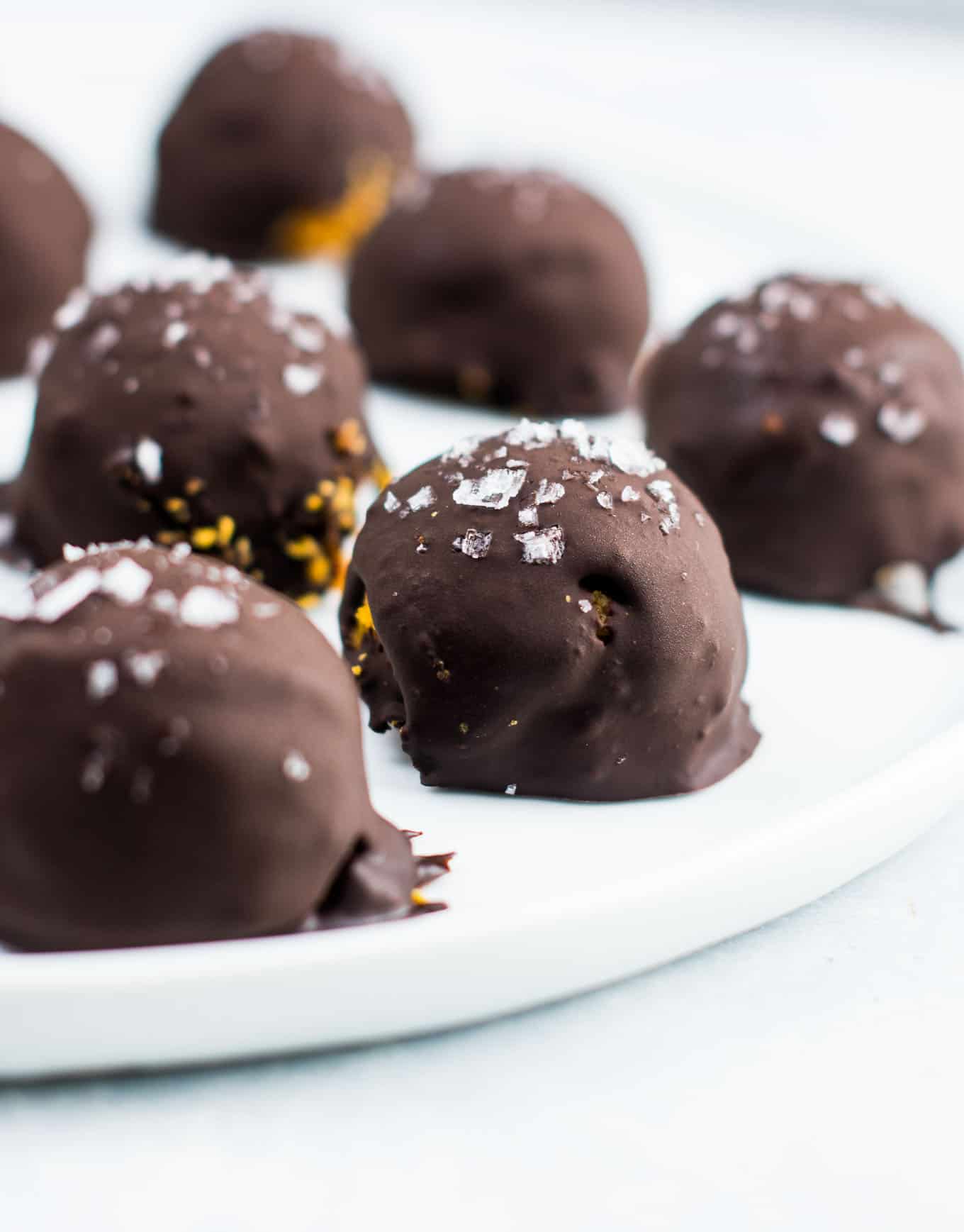 Dark chocolate pumpkin truffles on a plate