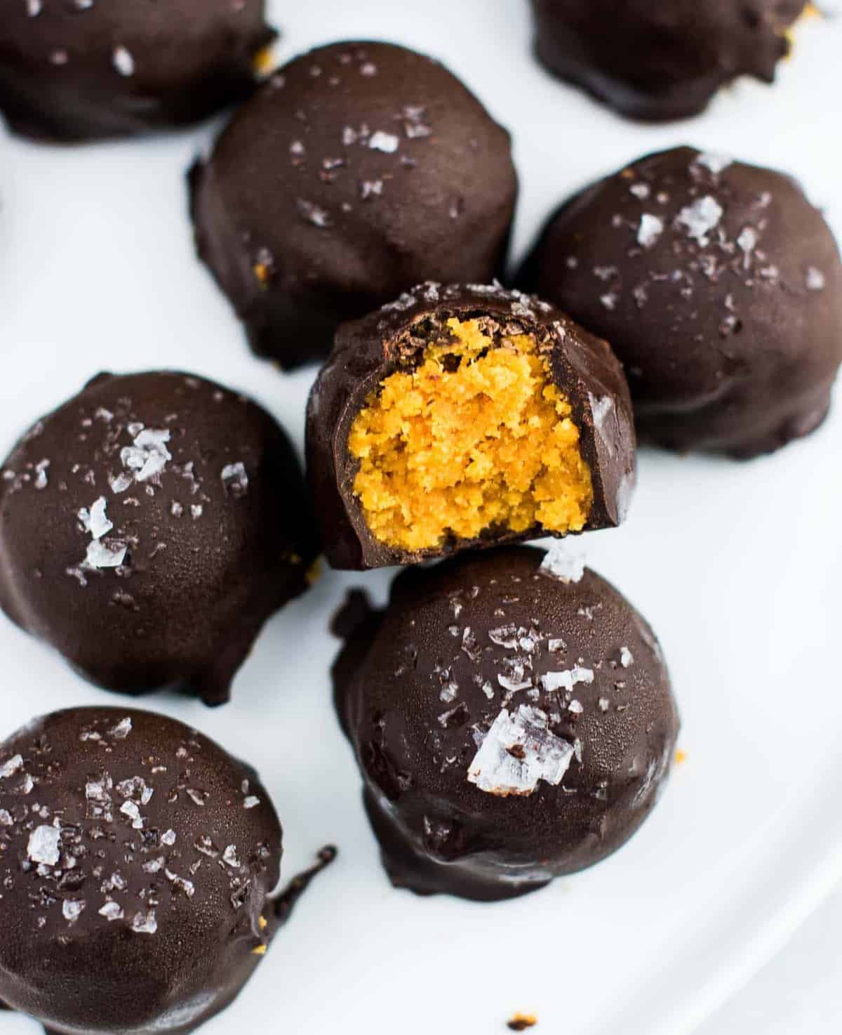 Dark chocolate pumpkin truffles on a plate