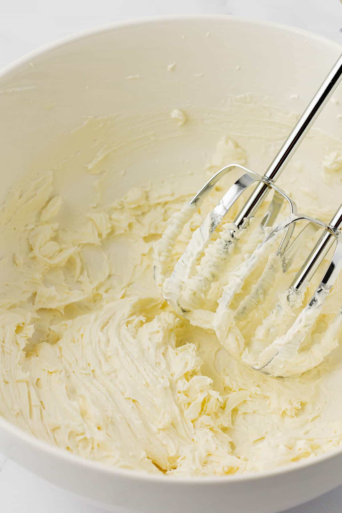 cream cheese whipped together in a mixing bowl