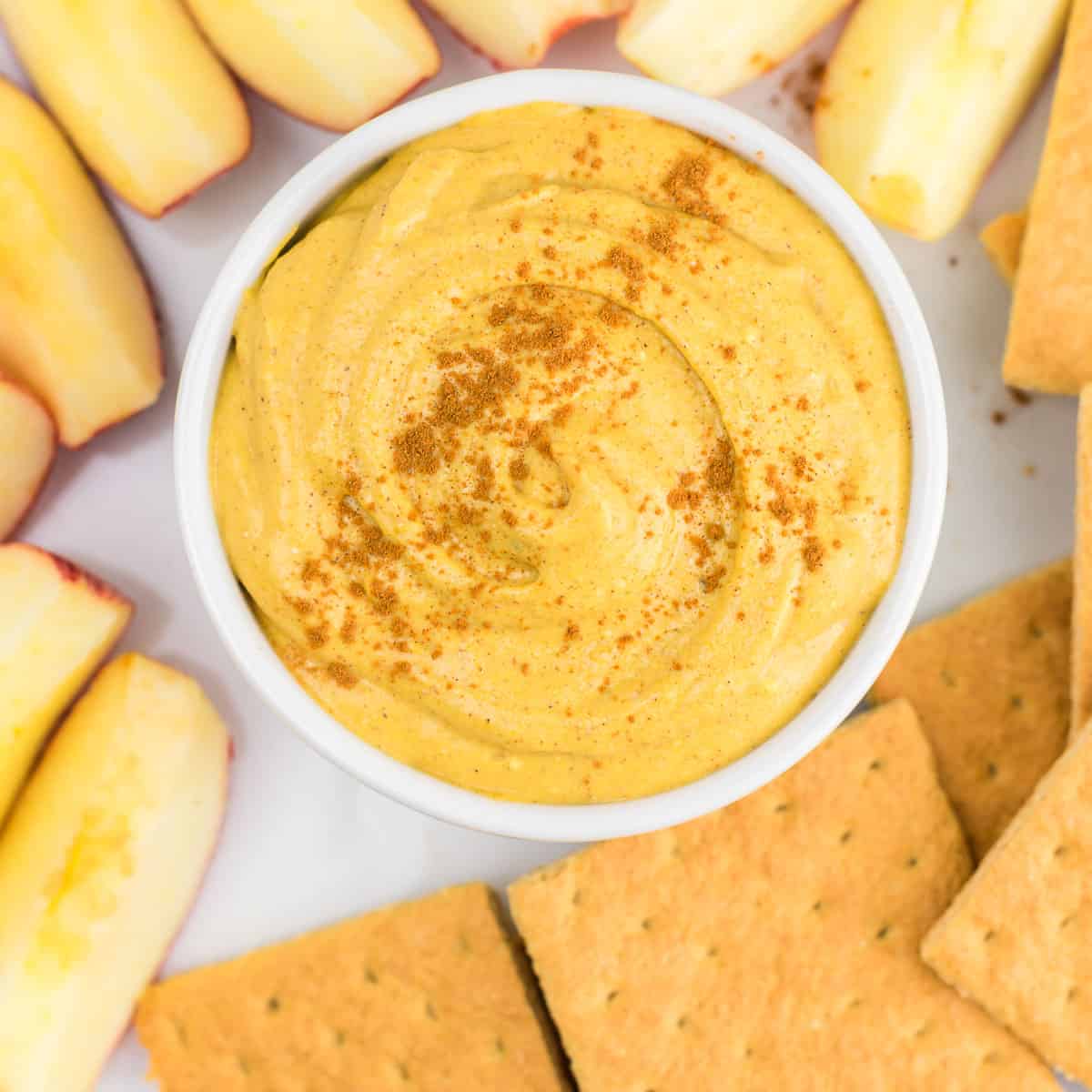 pumpkin cream cheese dip with graham crackers and apple slices