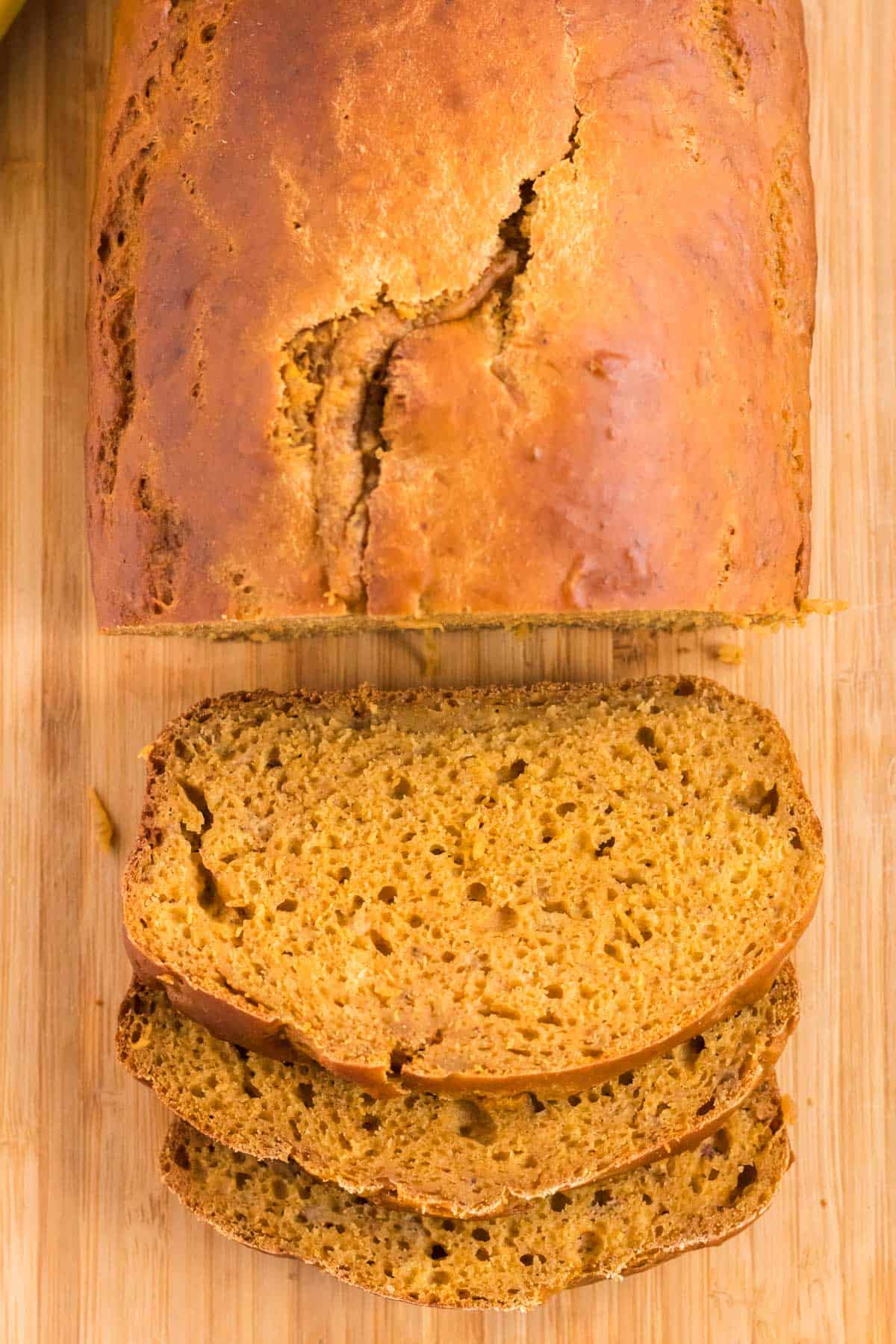 pumpkin bread being cut into slices