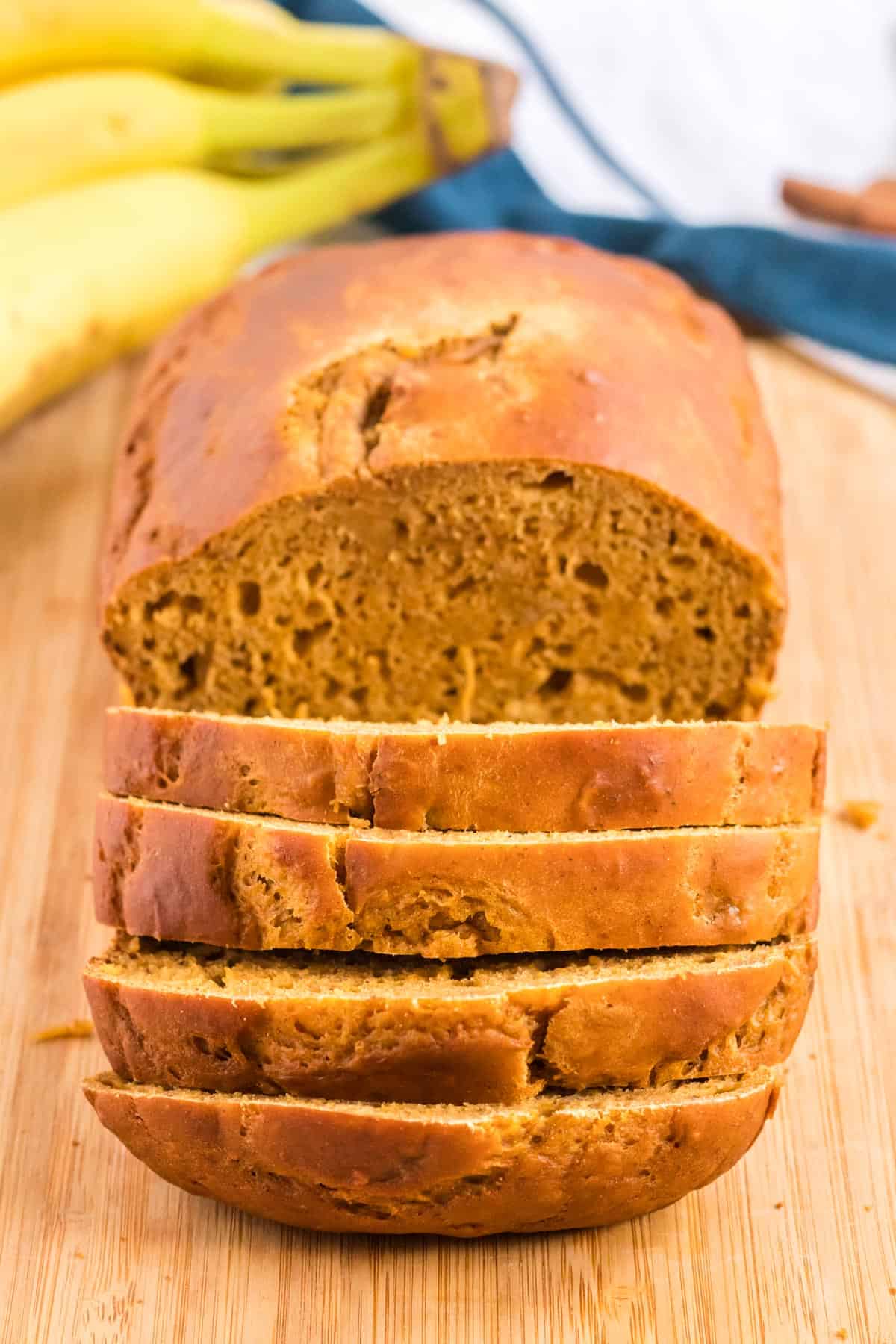 pumpkin bread being cut into slices