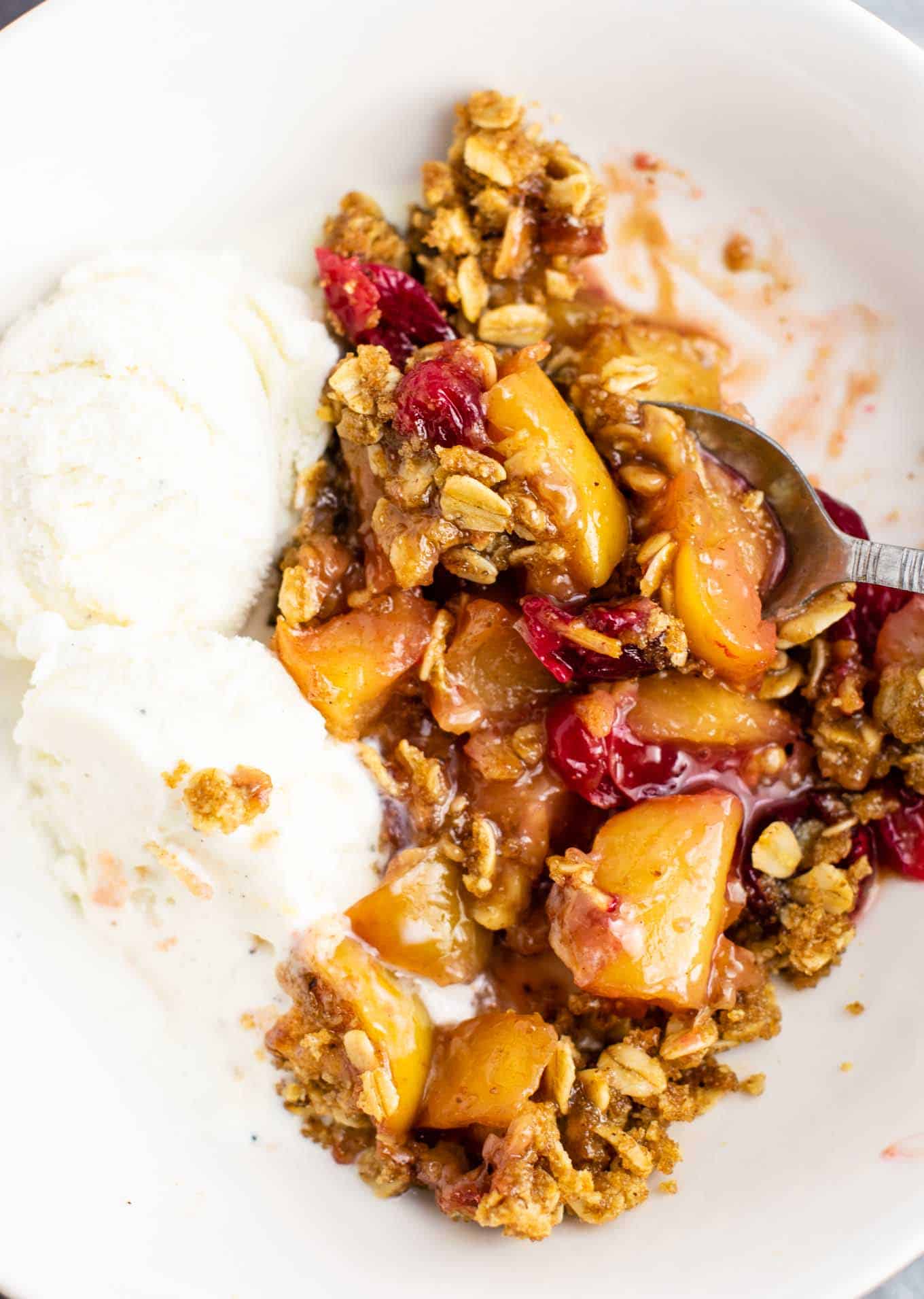 Fresh cranberry apple crisp with a gluten free oat topping. This is AMAZING! Make this for Thanksgiving, Christmas, or any day in between! #cranberry #cranberryrecipe #cranberryapplecrisp #dessert #glutenfree #glutenfreedessert
