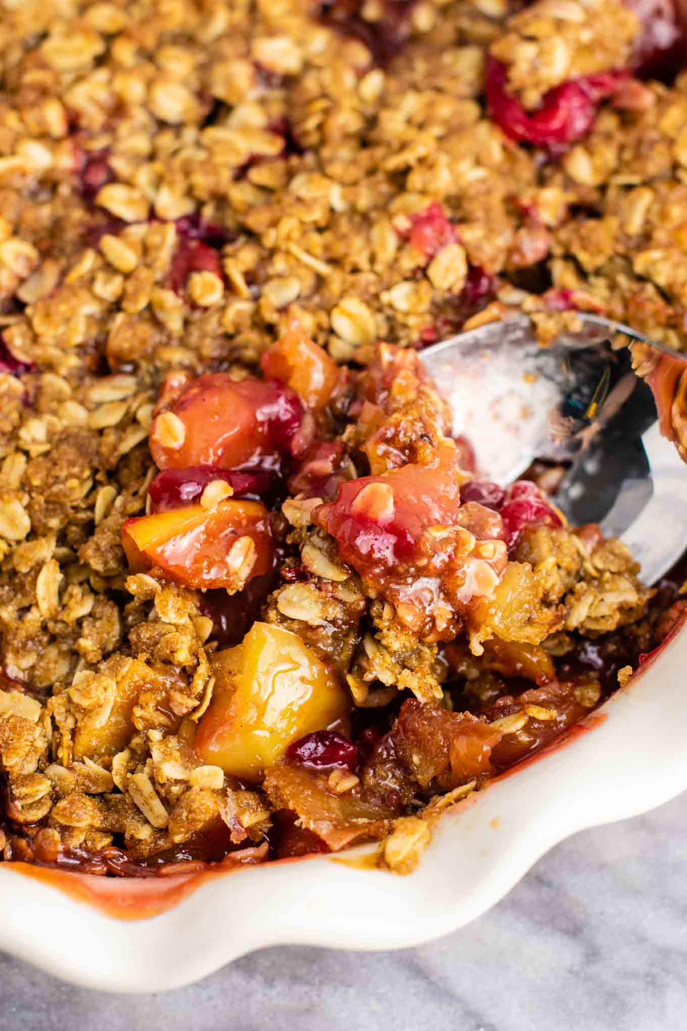 Fresh cranberry apple crisp with a gluten free oat topping. This is AMAZING! Make this for Thanksgiving, Christmas, or any day in between! #cranberry #cranberryrecipe #cranberryapplecrisp #dessert #glutenfree #glutenfreedessert