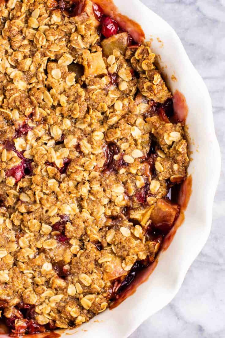 Fresh cranberry apple crisp with a gluten free oat topping. This is AMAZING! Make this for Thanksgiving, Christmas, or any day in between! #cranberry #cranberryrecipe #cranberryapplecrisp #dessert #glutenfree #glutenfreedessert