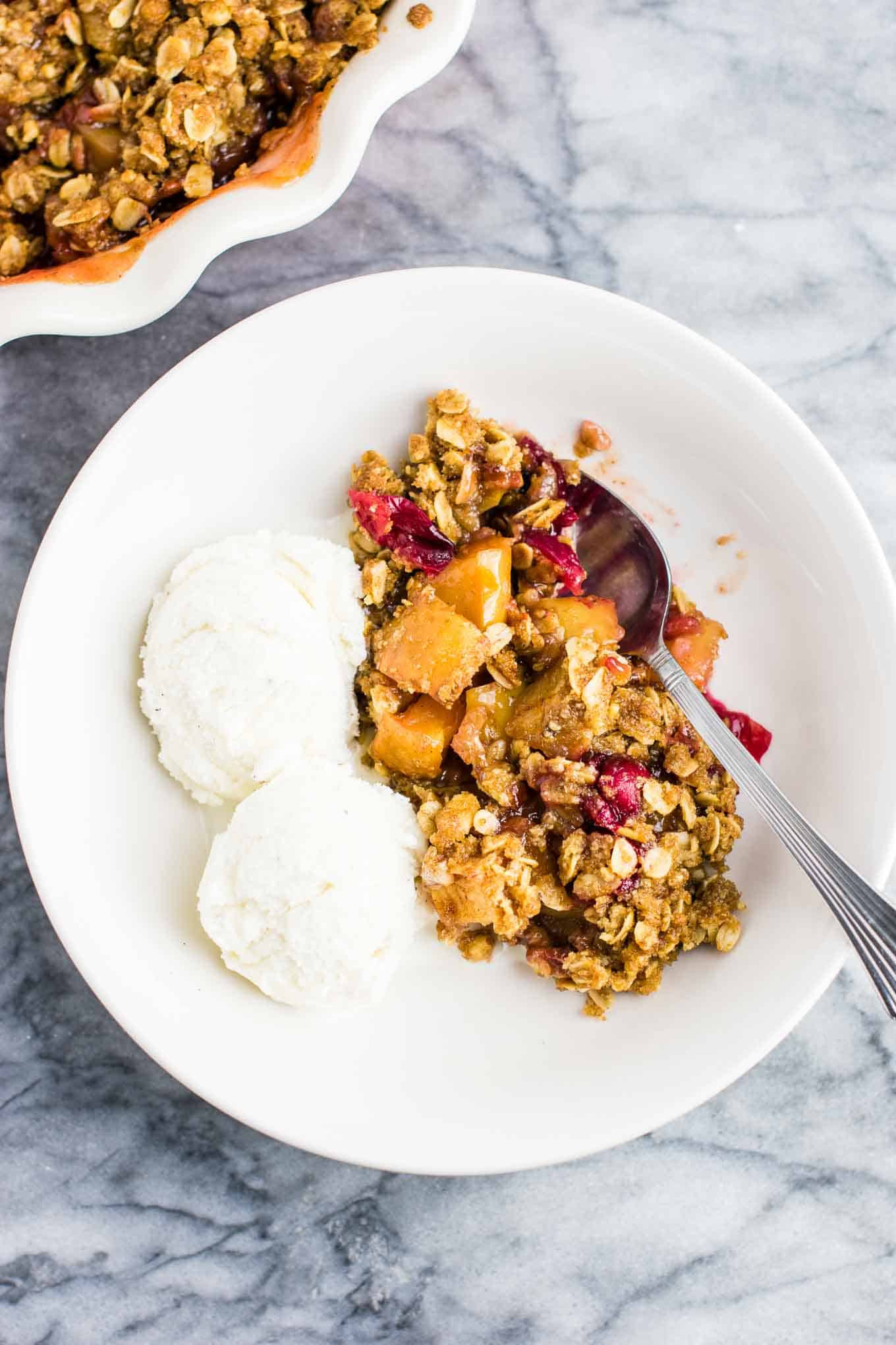 cranberry crisp with ice cream in a bowl