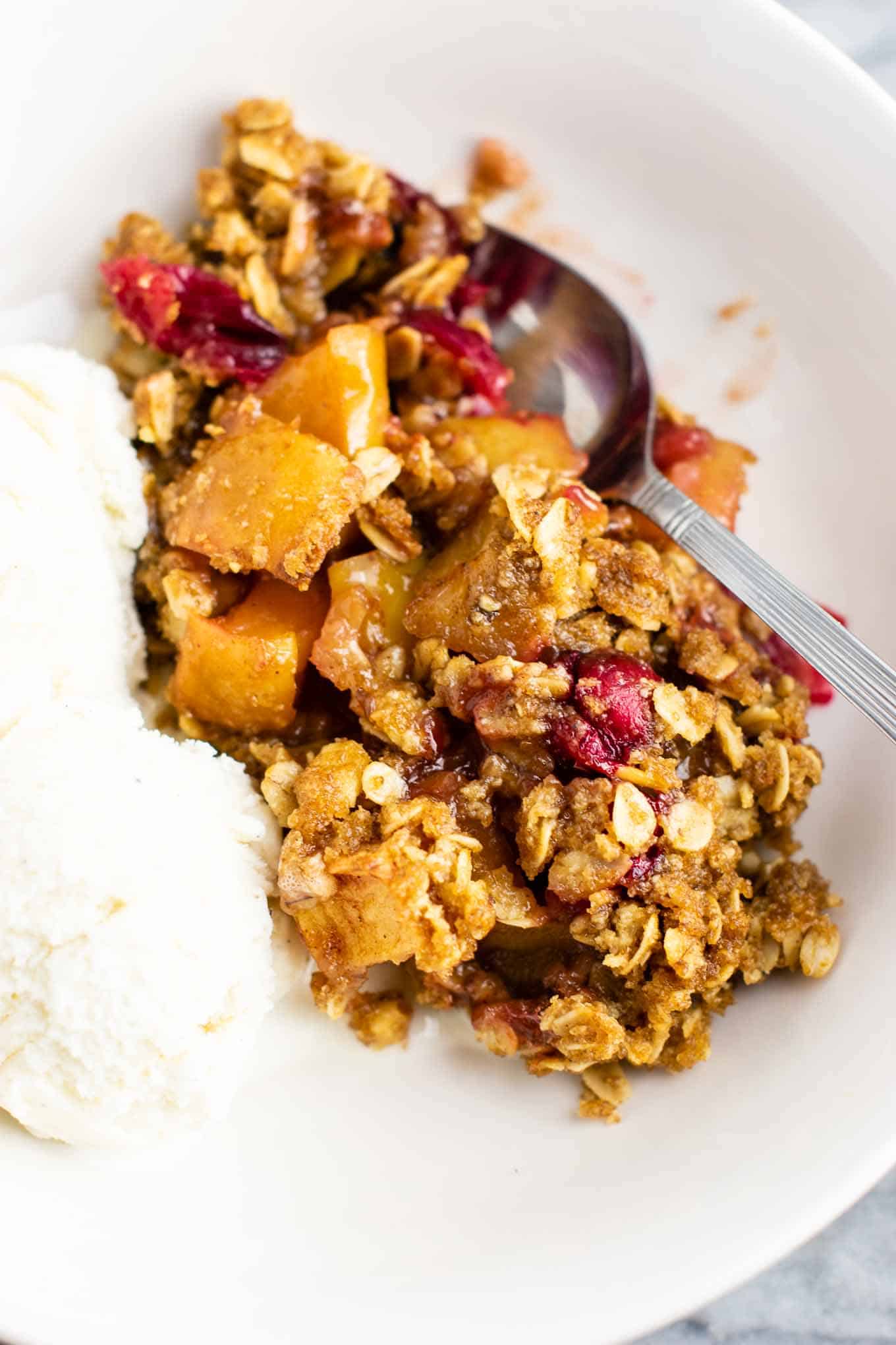 Fresh cranberry apple crisp with a gluten free oat topping. This is AMAZING! Make this for Thanksgiving, Christmas, or any day in between! #cranberry #cranberryrecipe #cranberryapplecrisp #dessert #glutenfree #glutenfreedessert