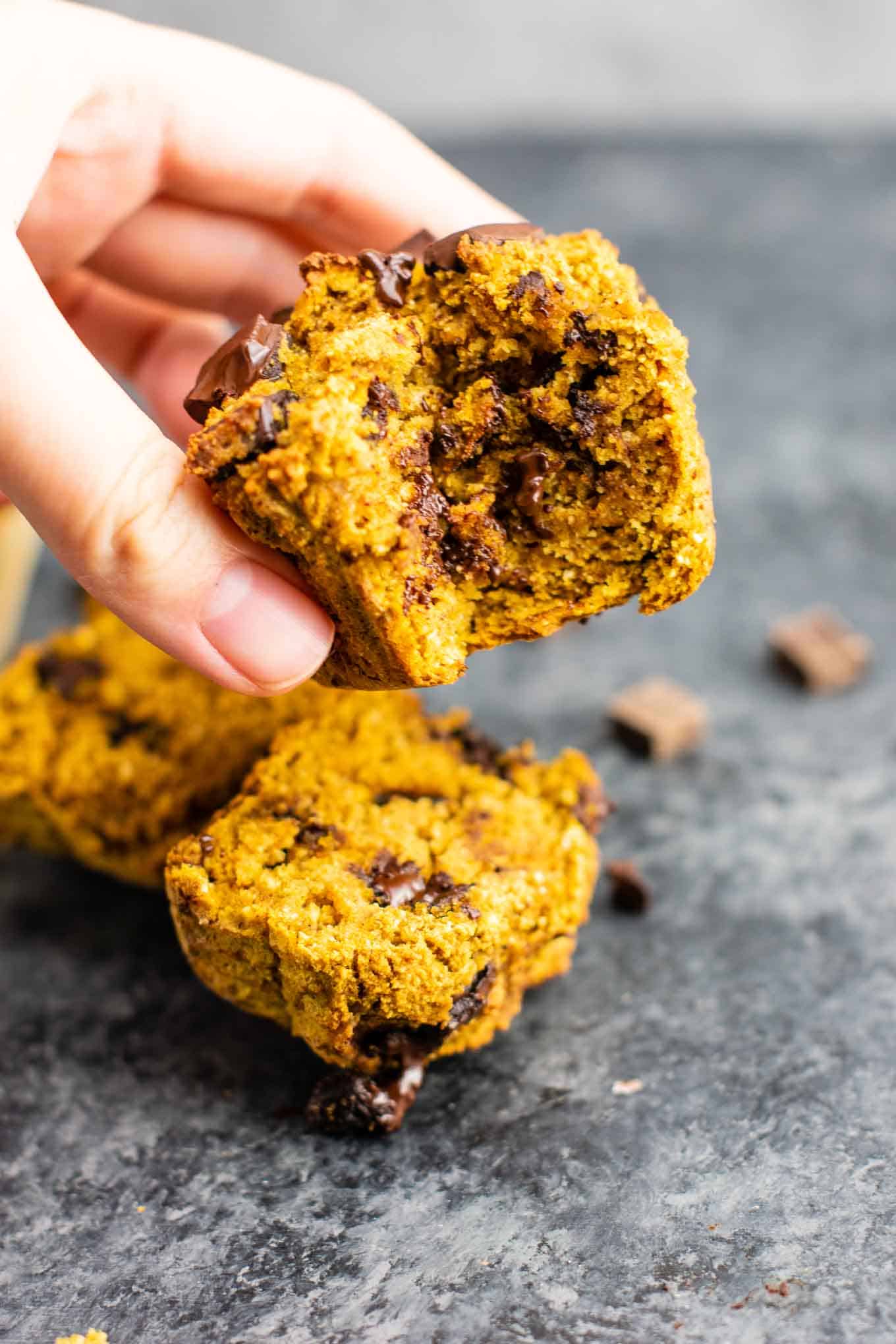 holding a gluten free pumpkin muffin