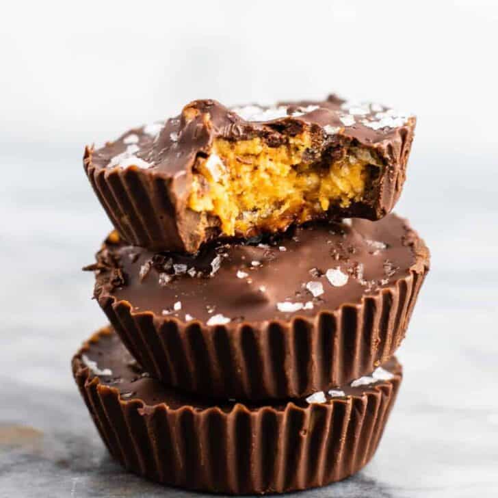 Chocolate peanut butter crunch cups with flaked sea salt – these are next level DELICIOUS! Vegan, gluten free, and tastes so good you won’t want to share! Perfect treat to keep in the freezer! #vegan #glutenfree #dessert #reesescups #vegandessert #glutenfreedessert #christmas #holidaytreat #seasalt